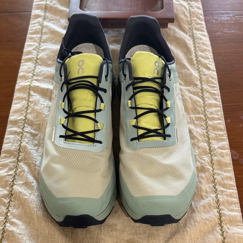 On Running Shoes with Black and Yellow Accents